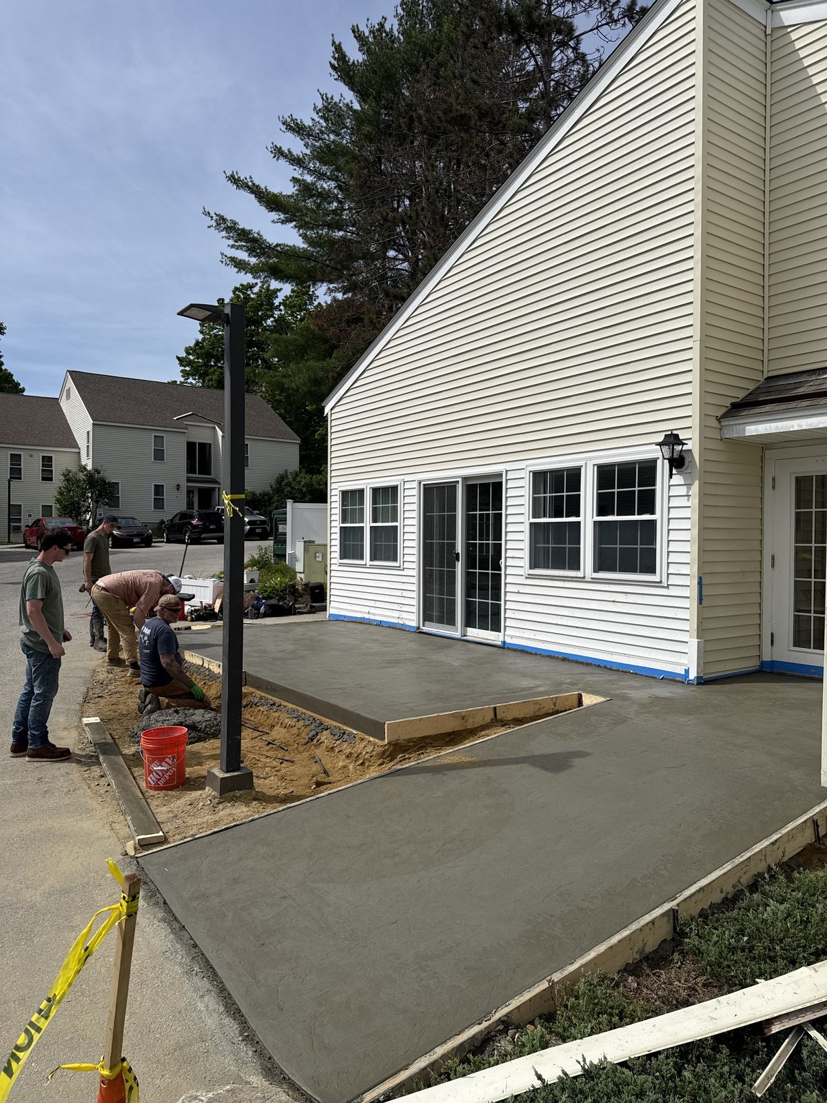 The 4 Brothers crew working together forming a new concrete patio