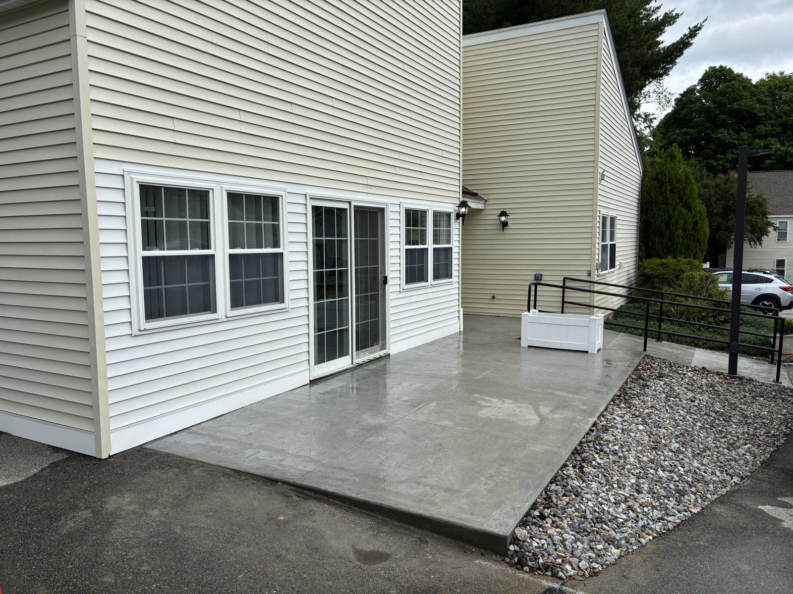 Finished concrete patio with a code-compliant railing